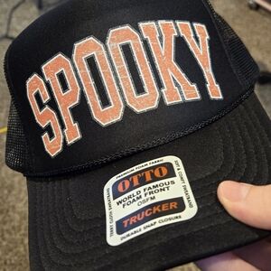 Spooky Halloween Trucker hat.   Black hat with orange spooky print.
